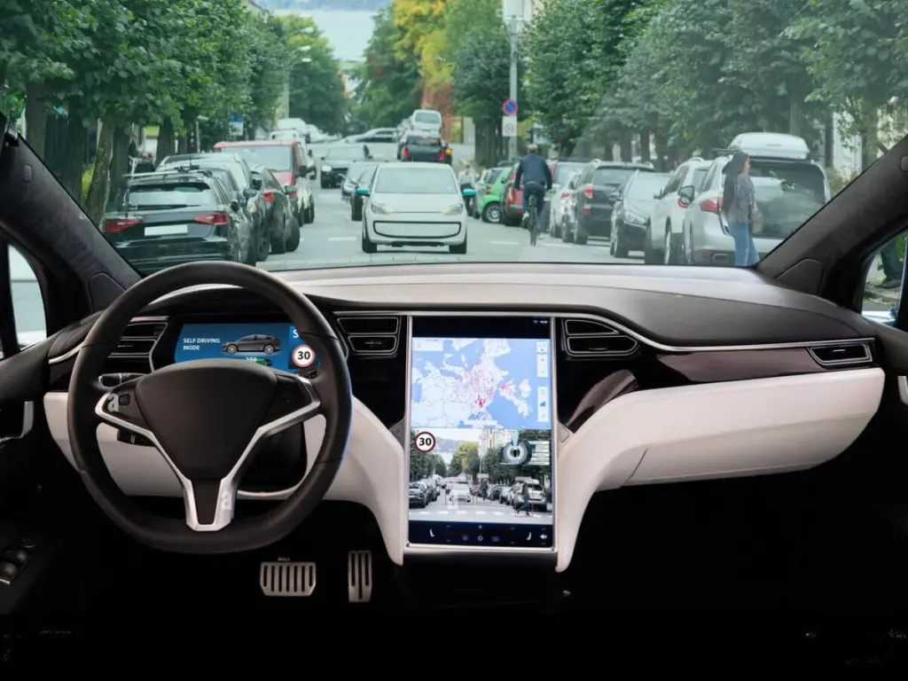 This image has an empty alt attribute; its file name is Tesla-Self-Driving-Car-Inside-1024x768.webp