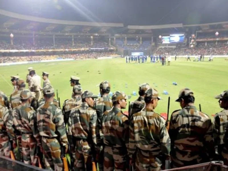 Security personnel monitoring IPL 2025 match at Eden Gardens with advanced technology.