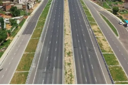 Construction equipment on Hyderabad-Vijayawada NH-65 for six-lane expansion in 2025