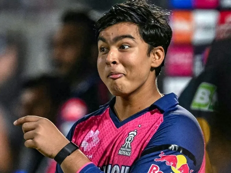 14-year-old Vaibhav Suryavanshi touches MS Dhoni's feet after RR's win over CSK in IPL 2025 at Arun Jaitley Stadium.