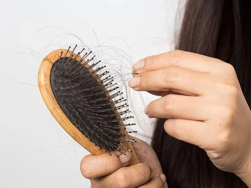 Silk pillowcase and loose braid for hair care at night, showcasing healthy hair tips in Telugu.