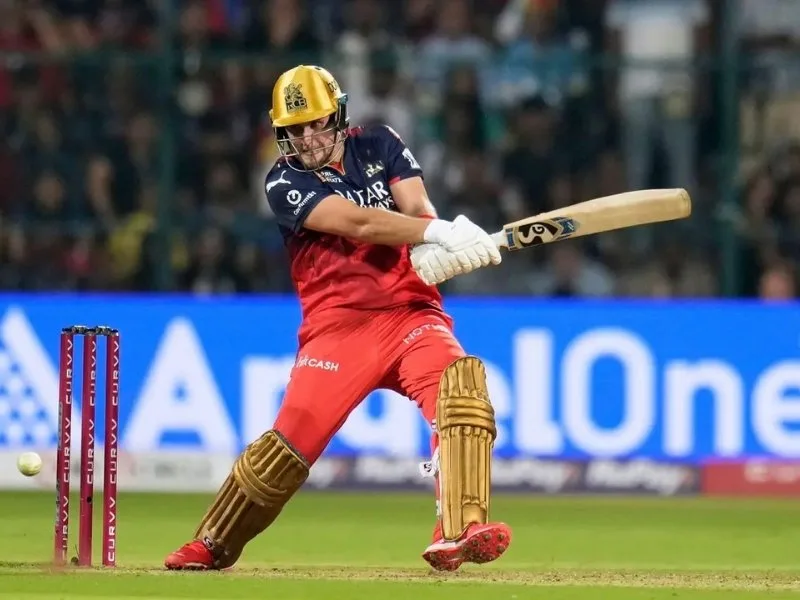 Liam Livingstone smashing a shot for RCB in IPL 2025, showcasing his all-round prowess.