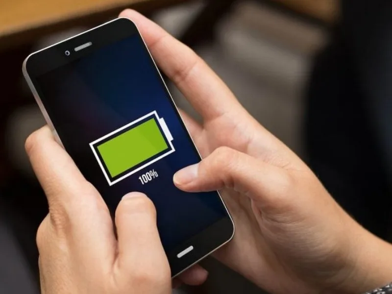 Phone charging with tips in Telugu to improve battery performance and avoid drain.