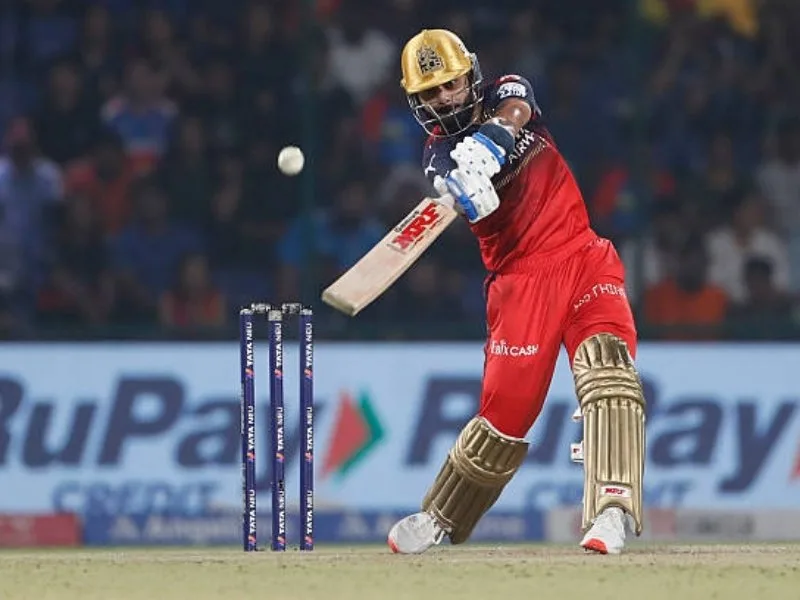 Virat Kohli striking a powerful shot, embodying his cricketing legacy.