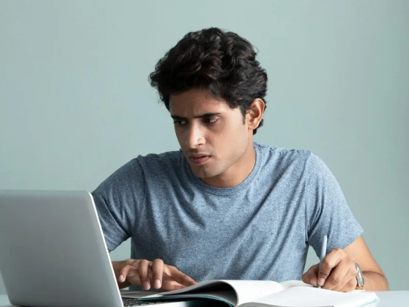 Candidates entering AP ICET 2025 exam center with hall tickets in Andhra Pradesh