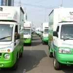 Andhra Pradesh ration door delivery vehicle distributing supplies to beneficiaries in 2025