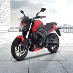 Bajaj Dominar 250 in Citrus Rush parked on highway with LED headlamps and sculpted tank
