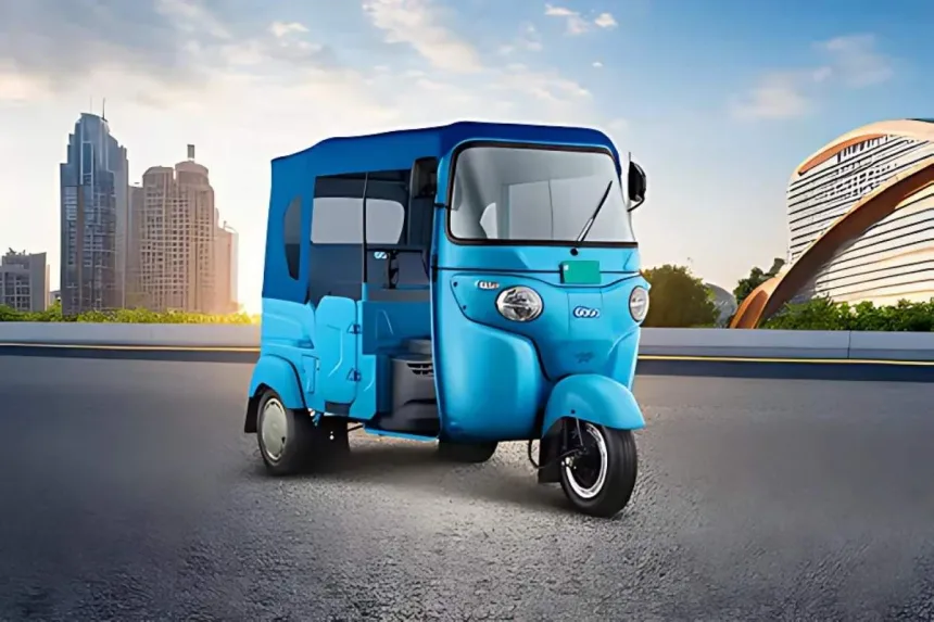 Bajaj GoGo P5009 in Ocean Blue parked on city street with LED headlights and rugged steel body