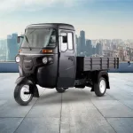 Bajaj Maxima XL Cargo E-TEC 12.0 electric three-wheeler on city road