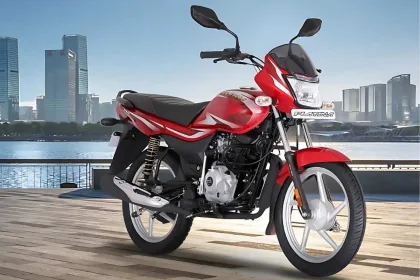 Bajaj Platina 100 motorcycle in Black with Silver color parked on city street