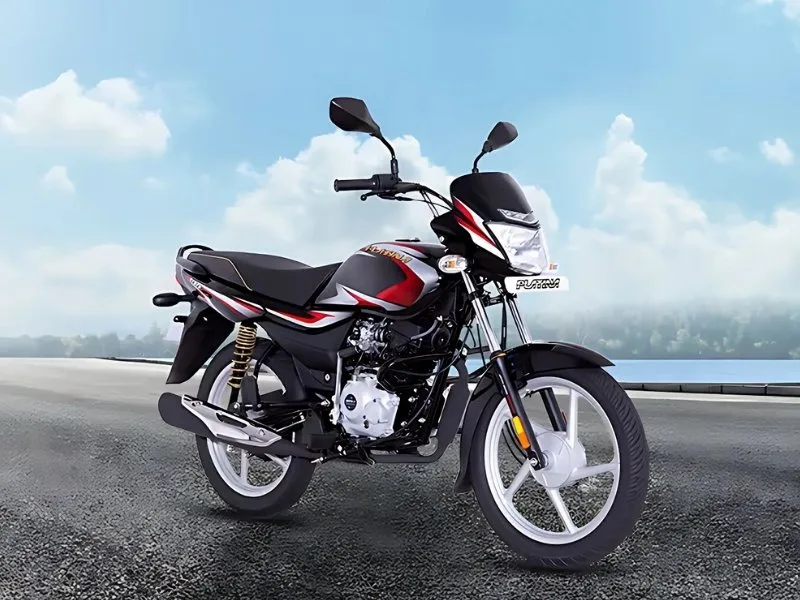 Close-up of Bajaj Platina 100 analog instrument cluster with speedometer and fuel