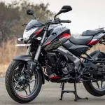 Bajaj Pulsar NS160 in Cocktail Wine Red parked on city street with sharp LED headlamp