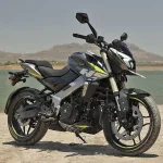Bajaj Pulsar NS400Z in Brooklyn Black parked on city street with sharp LED headlamp and muscular tank