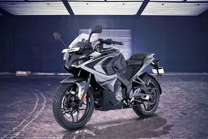 Bajaj Pulsar RS200 in Glossy Racing Red parked on city street with dual projector LED headlamps