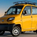 Bajaj Qute in Red parked on city street with compact quadricycle design and halogen headlights