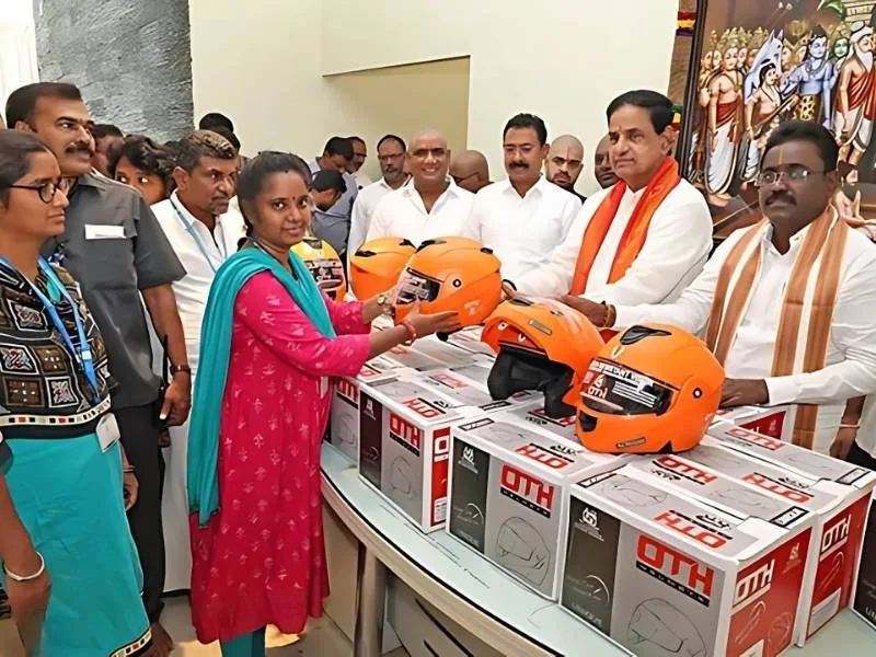 Chittoor traffic police explaining helmet safety to TTD(Tirumala) employees at a 2025 helmet distribution program