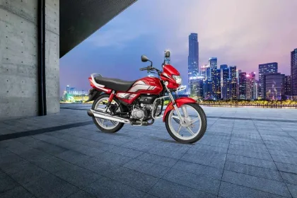 Hero HF Deluxe motorcycle in Black Nexus Blue color parked on city street