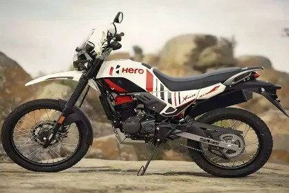 Hero XPulse 200 4V Dakar Edition parked on off-road trail with LED headlights and rugged adventure styling