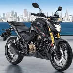 Honda CB300F in Sports Red parked on city street with aggressive streetfighter LED headlamp