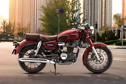 : Honda CB350 in Matte Dune Brown parked on city street with retro round LED headlamp