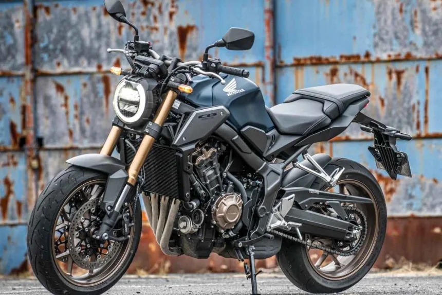 Honda CB650R in Matt Gunpowder Black Metallic parked on city street with neo-retro LED headlamp