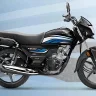 Honda CD 110 Dream in Black with Red parked on city street with chrome muffler cover