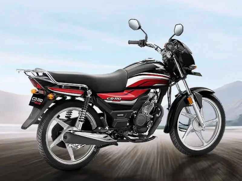Close-up of Honda CD 110 Dream two-pod analogue instrument cluster with speedometer