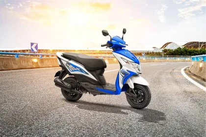 Honda Dio scooter in Pearl Igneous Black color parked on urban street