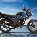 Honda Livo in Pearl Siren Blue parked on city street with halogen headlamp