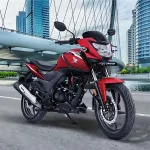 Honda SP160 motorcycle in Radiant Red Metallic parked on city street with LED headlamp