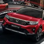 Honda WR-V 2026 in Platinum White parked in city with LED headlights, showcasing stylish compact SUV design