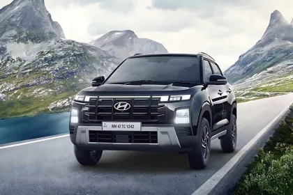 Hyundai Creta 2025 in Atlas White parked in city with LED headlights, showcasing stylish compact SUV design
