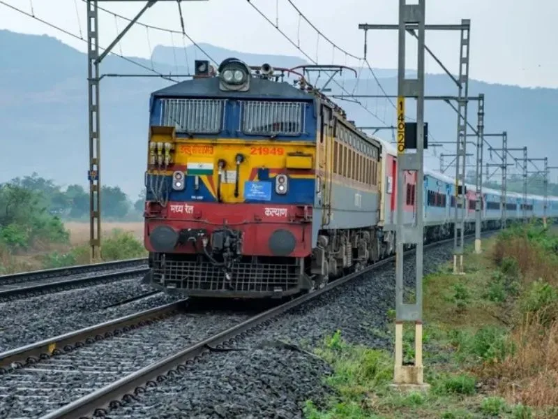 Passenger checking Indian Railways waiting ticket rules 2025 at a station counter