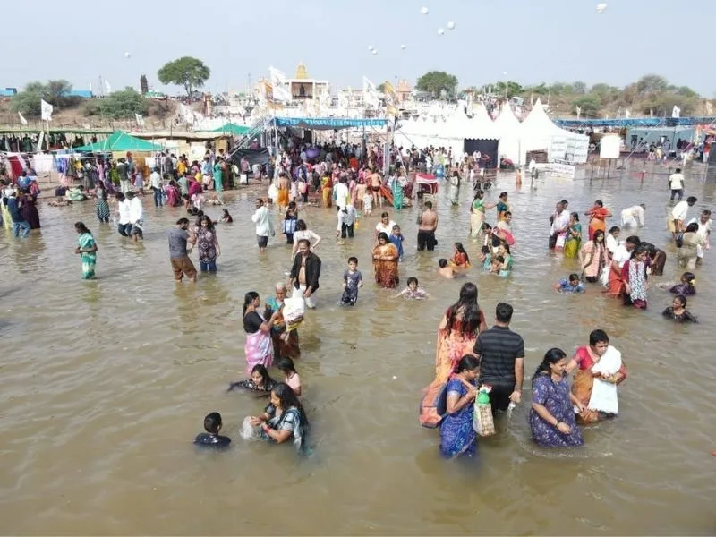 Devotees at Triveni Sangamam during Saraswati Pushkaram 2025 in Kaleshwaram
