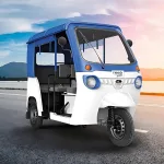 Mahindra Treo Yaari in Green parked on city street with LED headlights and 4-seater cabin