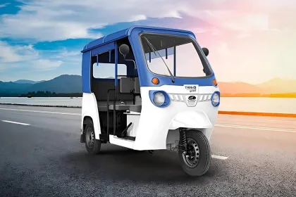 Mahindra Treo Yaari in Green parked on city street with LED headlights and 4-seater cabin