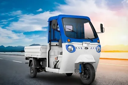 Mahindra Treo Zor in Green parked on city street with LED headlights and spacious cargo body
