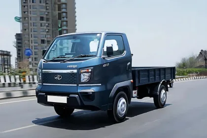Mahindra Veero in Silver parked on city street with LED DRLs and spacious cargo body