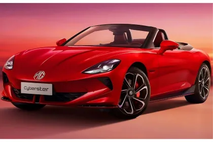 MG Cyberster 2025 in Dynamic Red with scissor doors open, showcasing futuristic electric sports car design