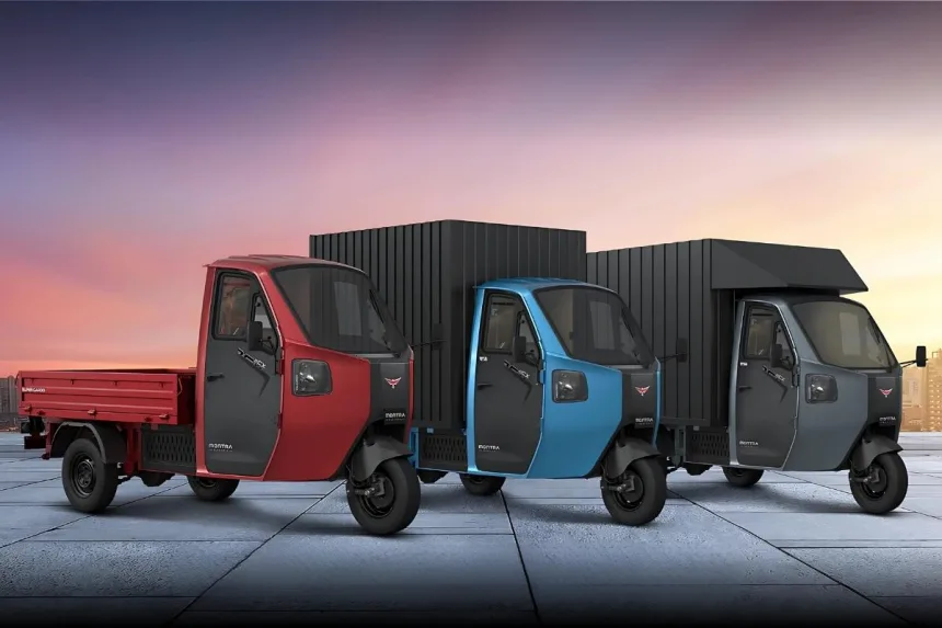 Montra Electric Super Cargo 2025 in green parked in city with cargo deck, ideal for eco-friendly logistics