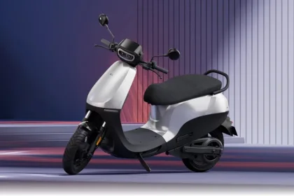 Ola S1 X electric scooter in Midnight Blue color parked on city street with LED headlight