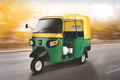 Piaggio Ape Auto DX BS6 in Green parked on city street with halogen headlights and 3-seater cabin