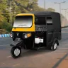Piaggio Ape City Plus 2025 in Green parked on city street with halogen headlights and 3-seater cabin