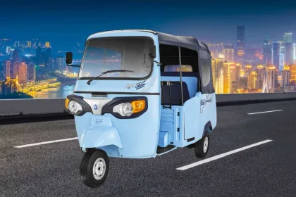 Piaggio Ape E-City FX Max 2025 in Green parked on city street with LED headlights and 3-seater cabin