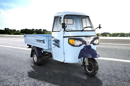 Piaggio Ape E-Xtra FX in Green parked on city street with LED headlights and spacious cargo body
