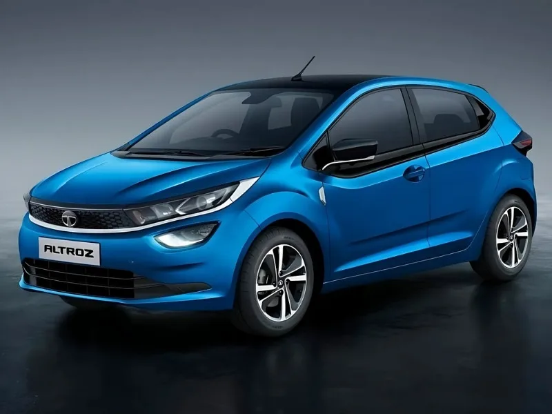 Tata Altroz 2025 in Opera Blue parked in city with LED headlights, showcasing stylish hatchback design
