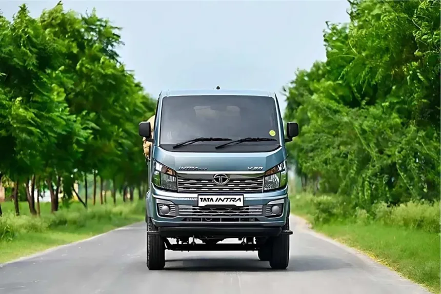 Tata Intra V50 BS6 2025 in white parked in city with cargo deck, ideal for small business logistics