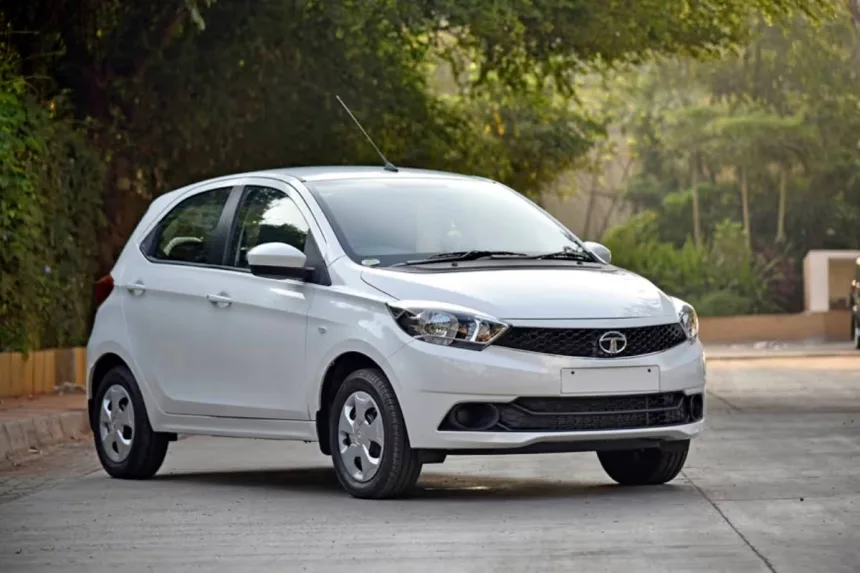 Used Tata Tiago XTA AMT in Arizona Blue parked on New Delhi street with LED DRLs and stylish design