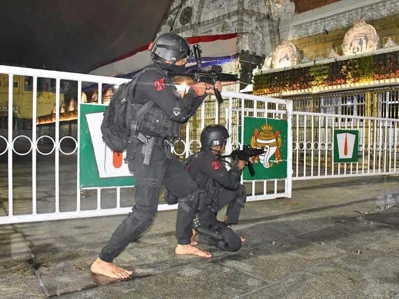Security personnel patrolling near Akhilandam at Tirumala during 2025 safety drill