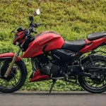 TVS Apache RTR 200 4V motorcycle in Matte Blue parked on city street with LED headlamp